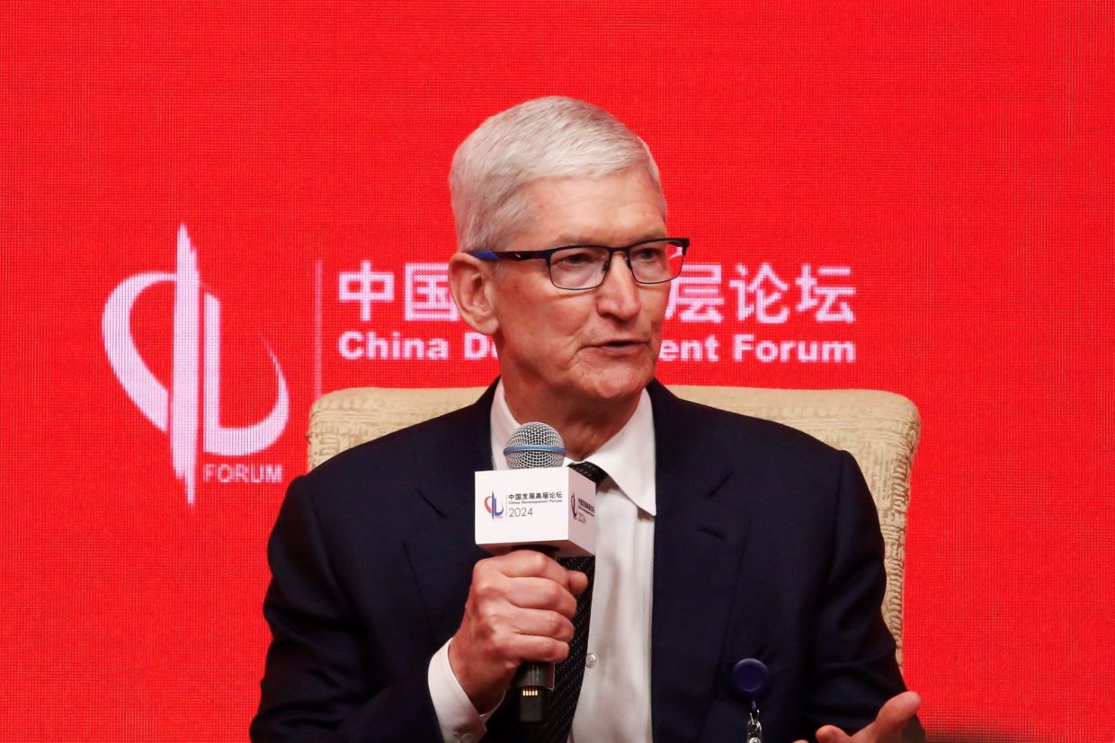 Apple’s Tim Cook tells China forum AI is key for climate battle