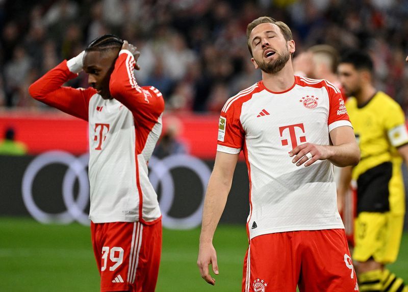 Soccer-Bayern Munich's title hopes in tatters after 2-0 loss to Dortmund