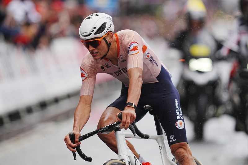 Cycling-Van der Poel hammers rivals to win Flanders triple crown