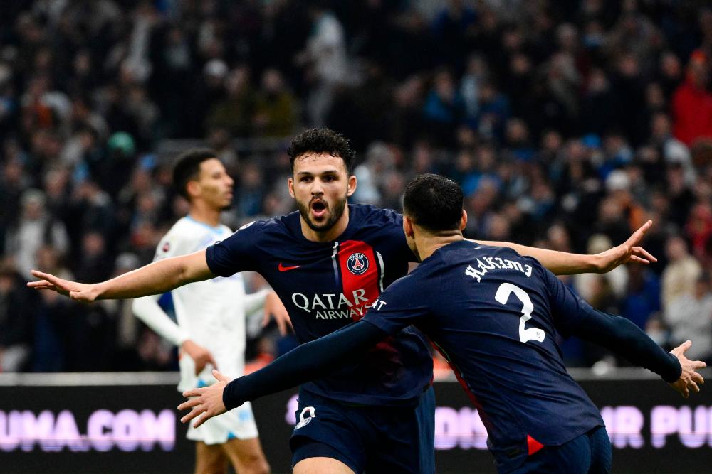 PSG overcome red card to beat Marseille