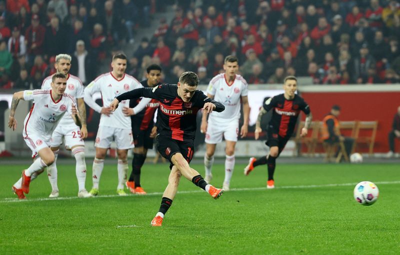Soccer-Flawless Leverkusen cruise past Dusseldorf into German Cup final