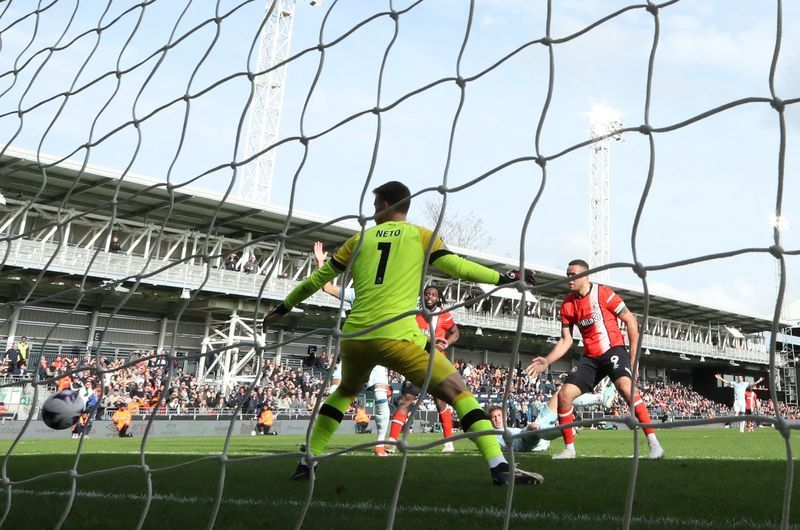 Soccer-Luton strike late for vital win over Bournemouth