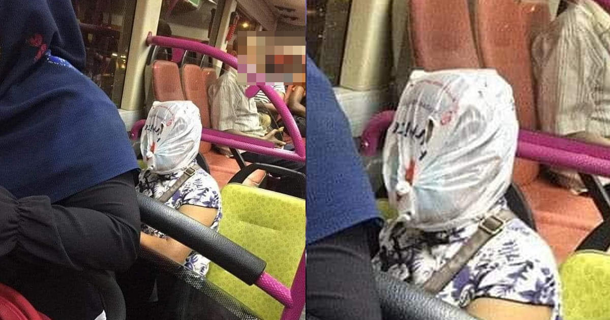 WOMAN SPOTTED COVERING FACE WITH PLASTIC BAG ON BUS