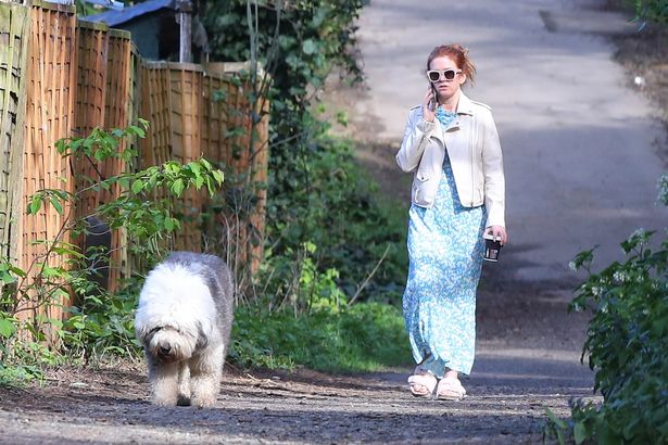 Downcast Isla Fisher ditches her wedding ring as she breaks cover after Sacha Baron Cohen split