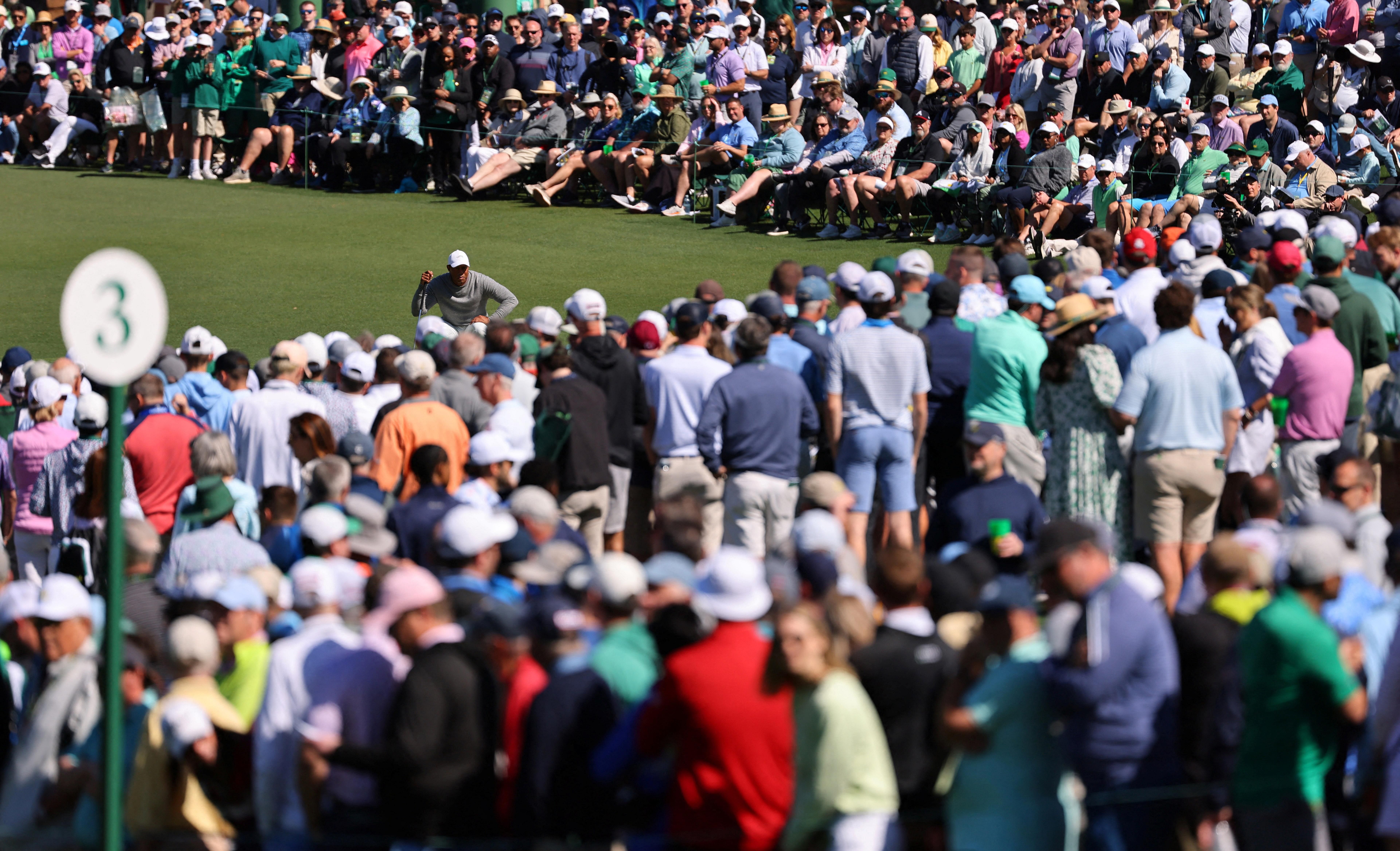 Adoring Augusta cheers Tiger Woods into another Masters weekend