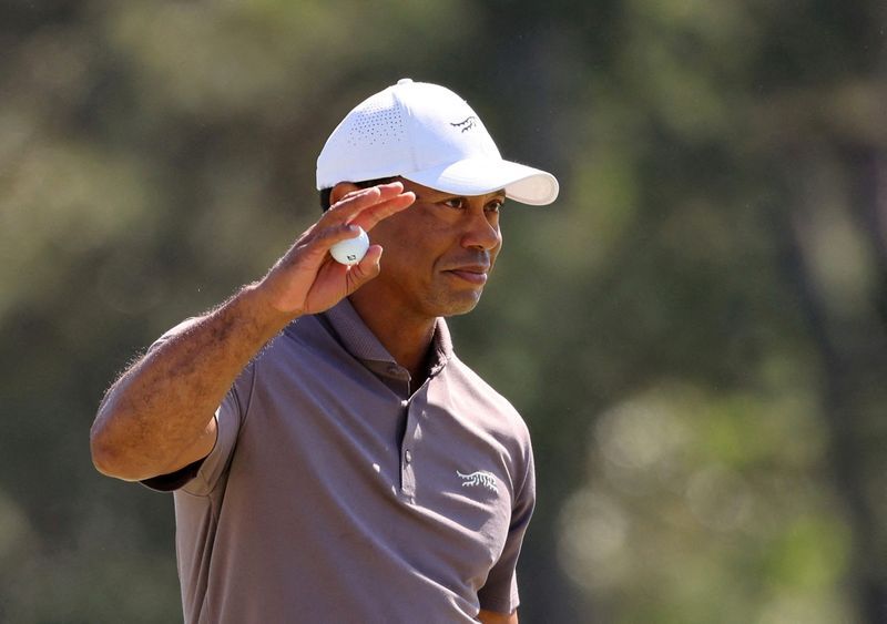 Golf-Woods in position to break Masters record for made cuts