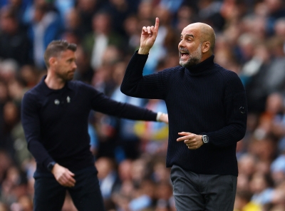 Man City boss Guardiola warns it is too soon to dream about double treble
