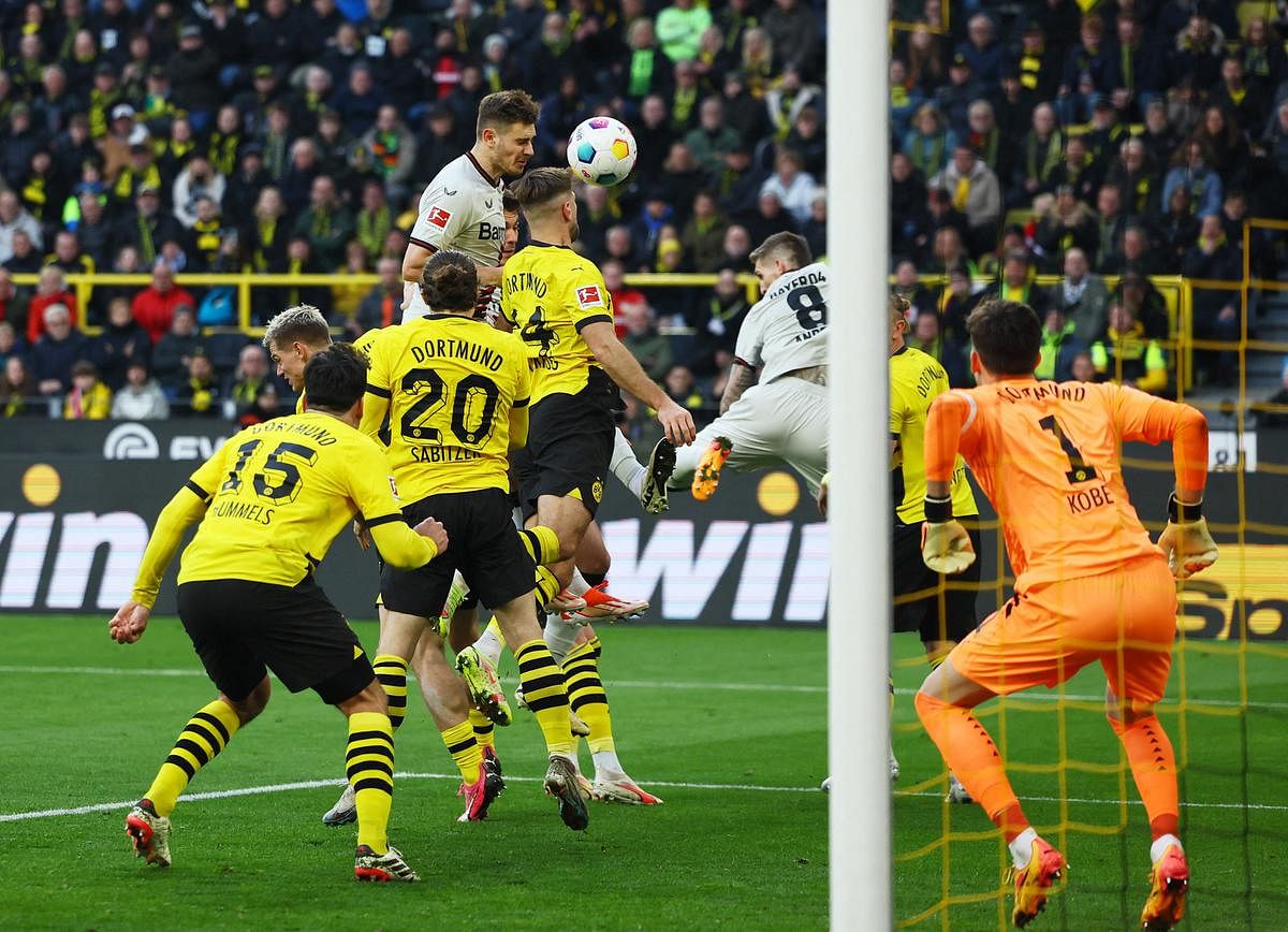 Late Stanisic goal at Dortmund salvages Leverkusen's unbeaten run