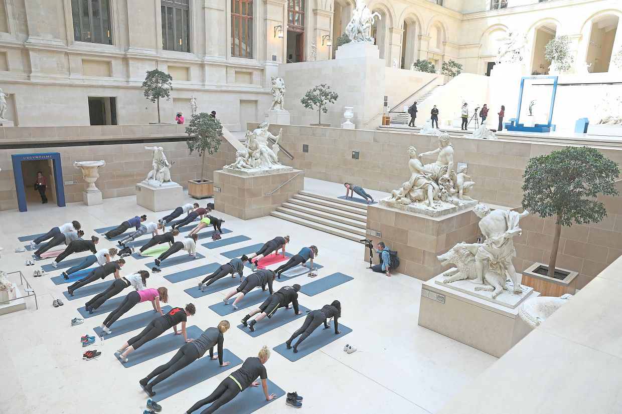 Flexing and fine art: Louvre introduces Olympic sport sessions