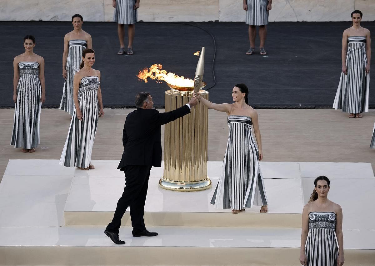 Paris organisers receive flame in Athens ahead of relay