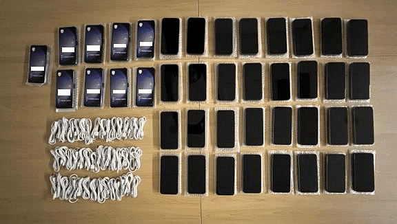 Four men charged over alleged sale of fake iPhones at discounted prices
