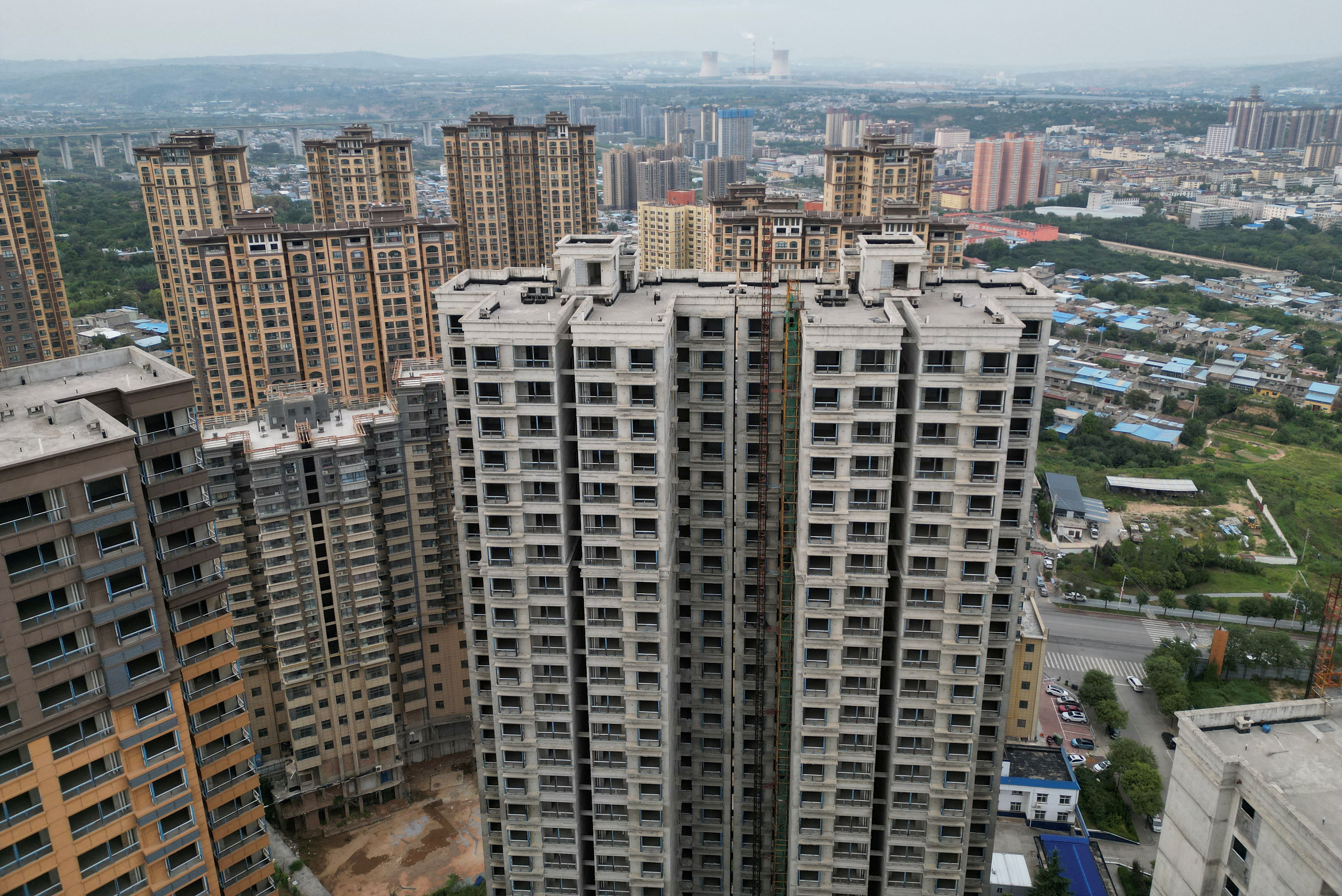 Strained Chinese cities struggle to pay home buying subsidies