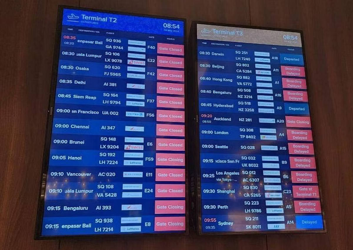 Flood warnings issued as heavy rain drenches Singapore, causes delays at Changi Airport