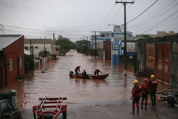 Major storms in Brazil burst hydroelectric dam as people left stranded on rooftops amid flooding