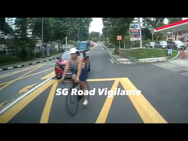 Tanglin Road cyclist fail to conform to red light signal & squeeze thruthe pedestrians