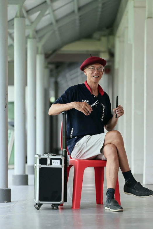 'I hope it will give them a sense of community care and love': Retiree dubbed 'little red hat' gives free haircuts to elderly and needy