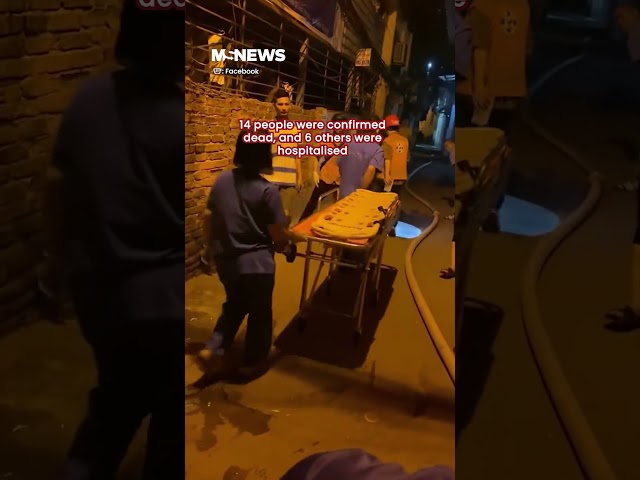 Vietnamese man smashes burning building's wall to save 3 victims