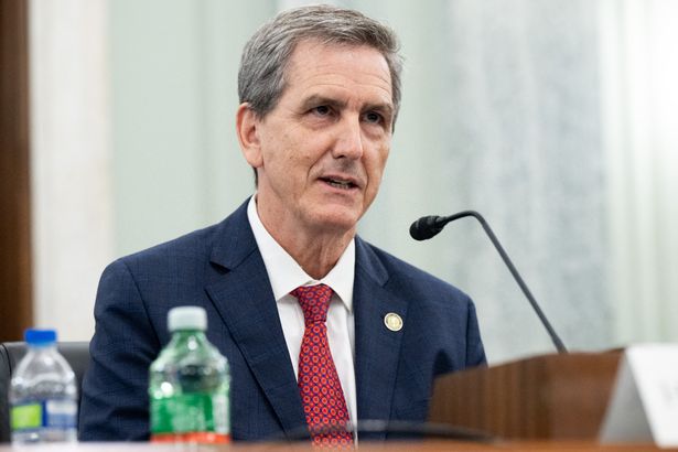 Passenger duct-taped to chair after trying to open plane door sued for fine she never paid