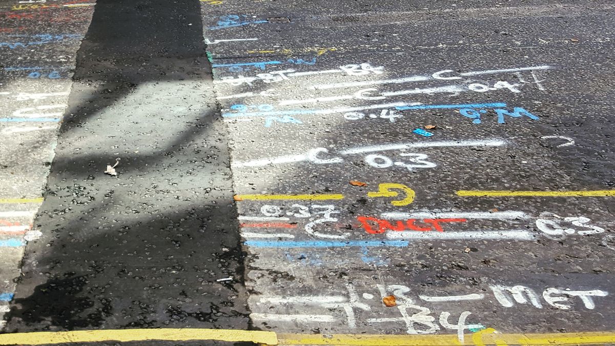 People baffled over mysterious spray-painted markings on pavement outside homes