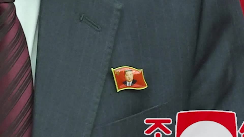 Kim jong UN pins first seen on North Korea officials