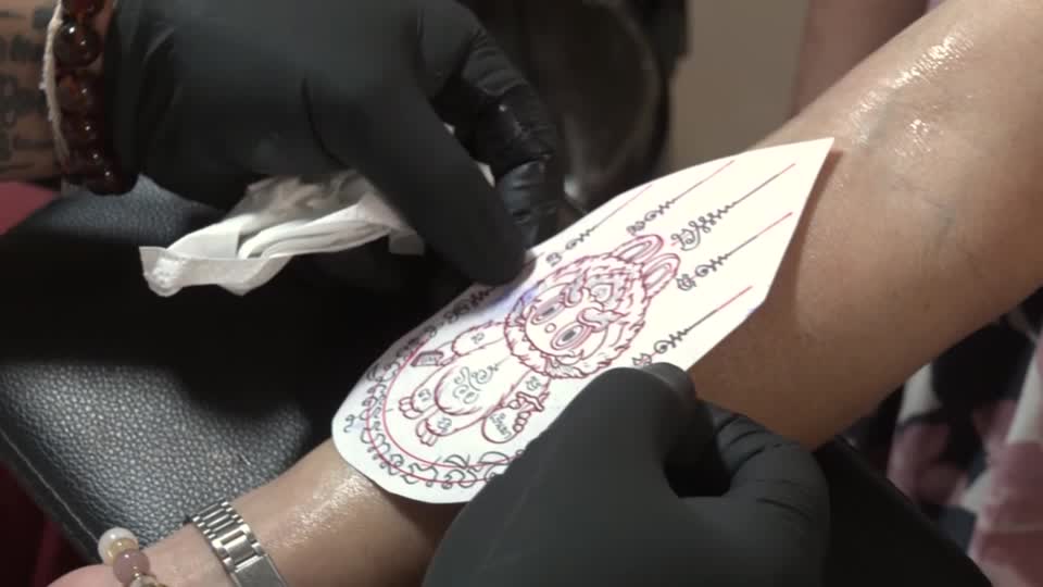 An art toy mascot becomes a lucky tattoo in Thailand
