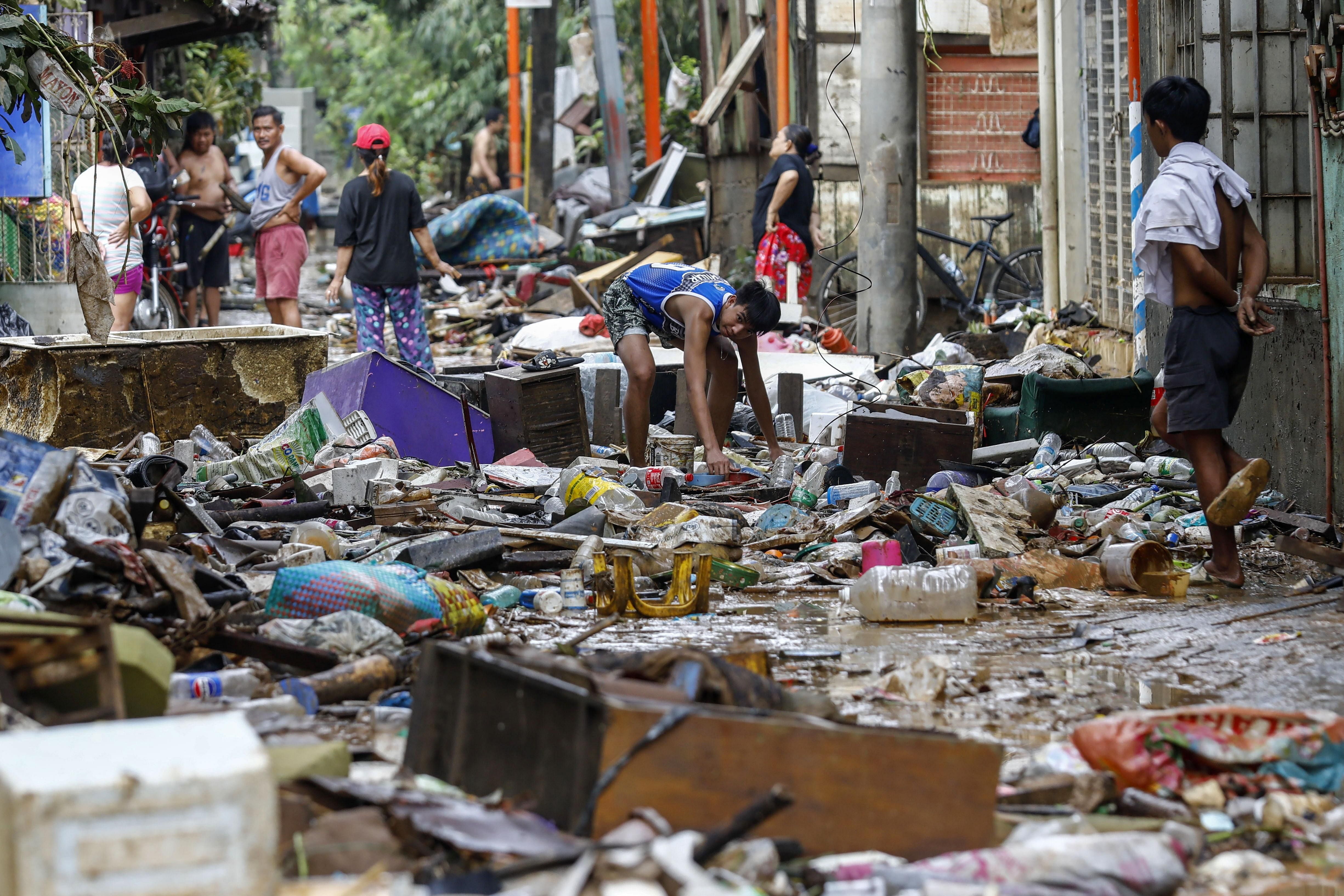 ‘Back to zero’: Manila flood victims face daunting task of cleaning up, rebuilding lives