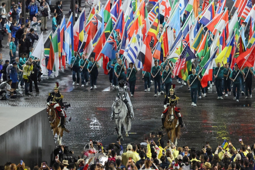 Flotilla on Seine, rain and Celine Dion mark start of Paris Olympics