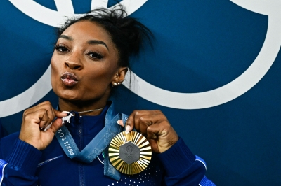 Simone Biles seals GOAT status with gold medal and goat bling