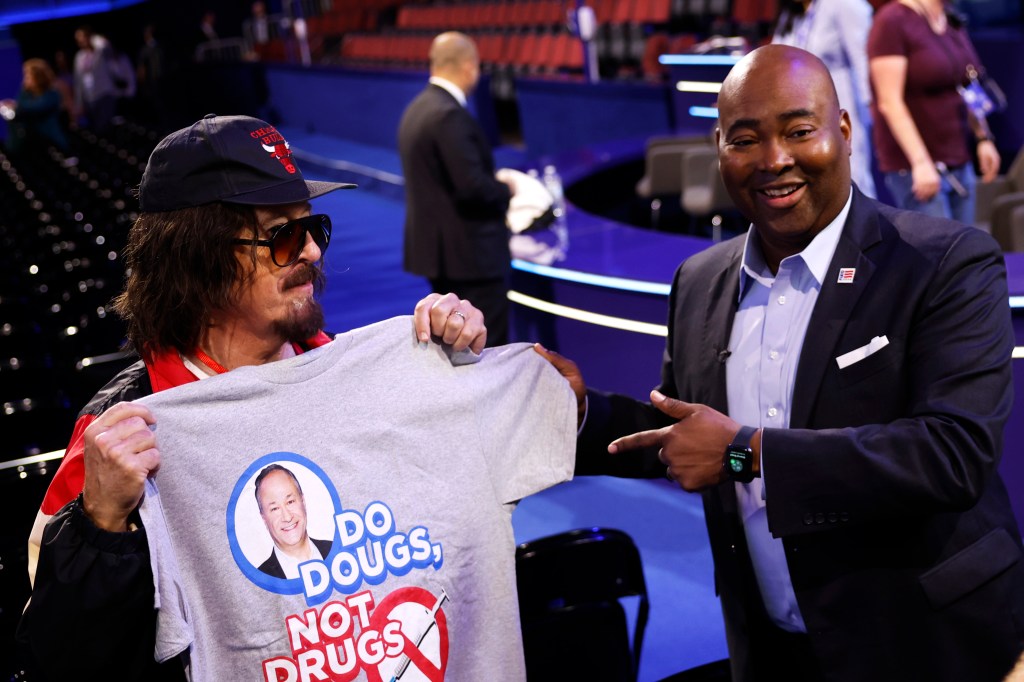 Stephen Colbert brings back his Donny Franks alter-ego — and gives a hot dog to AOC — at the DNC