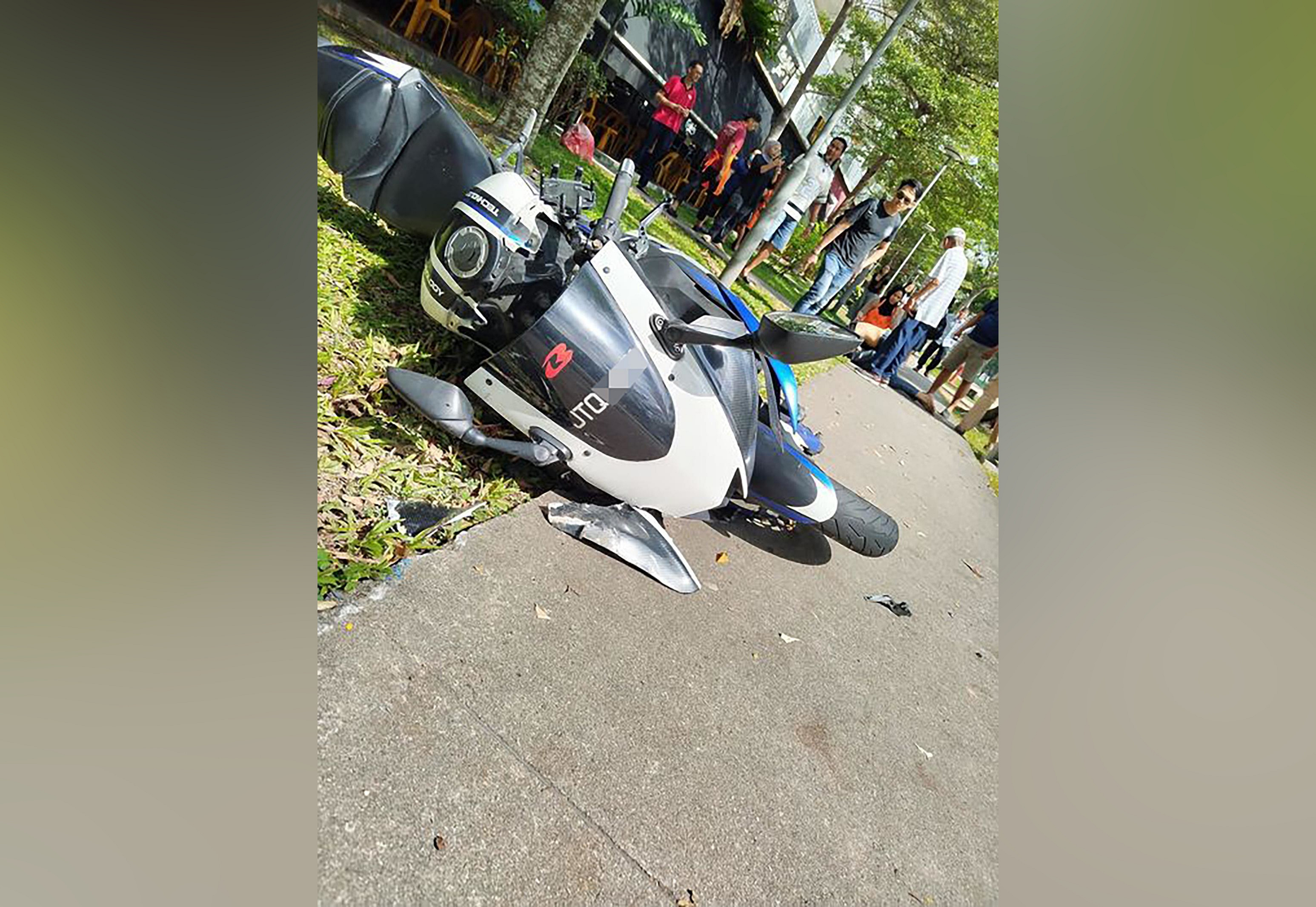 Taxi driver, 67, arrested after accident in Sembawang that left motorcyclist unconscious
