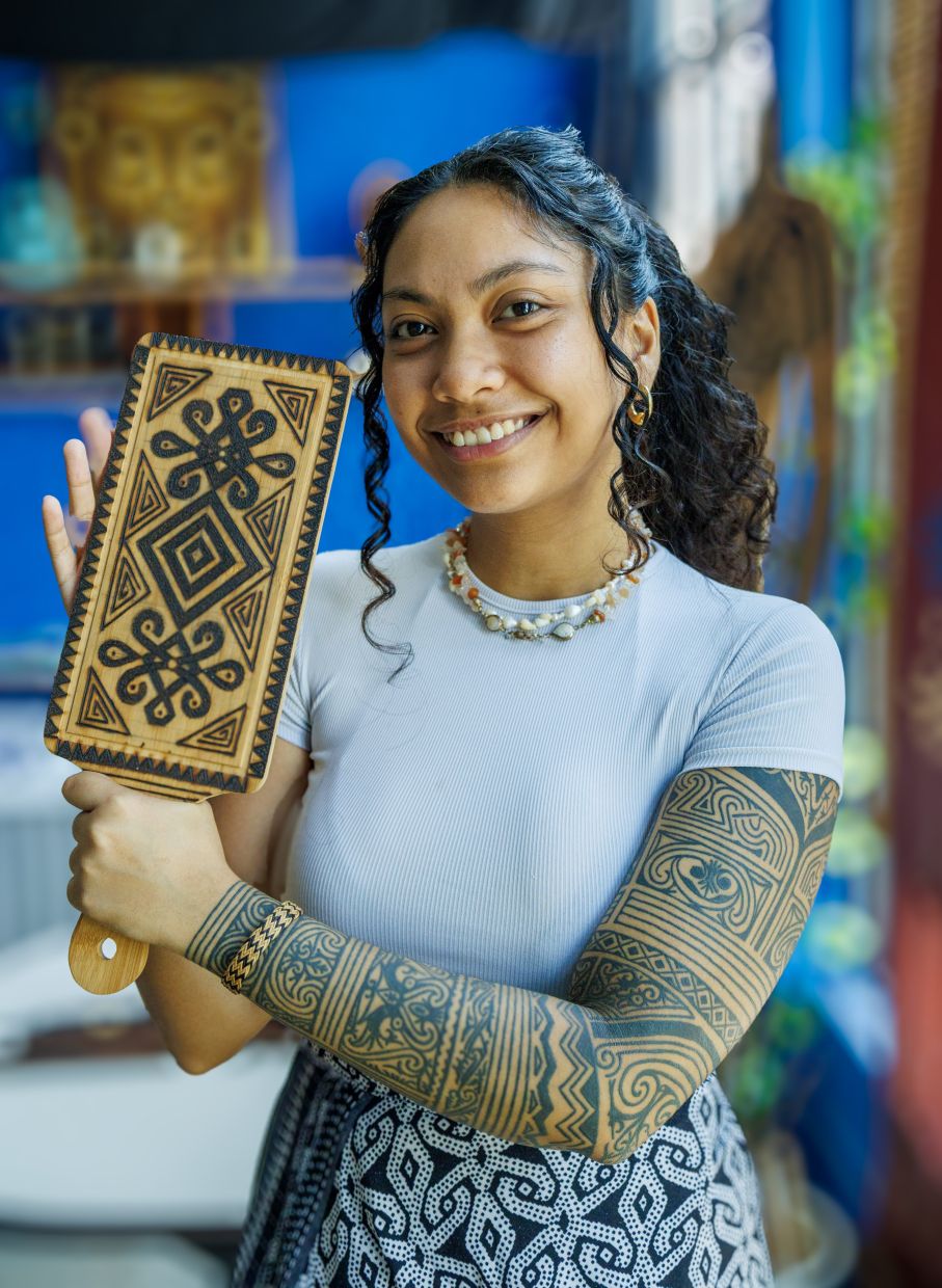 A Malaysian tattoo artist inks the motifs of pua kumbu as a tribute to her roots
