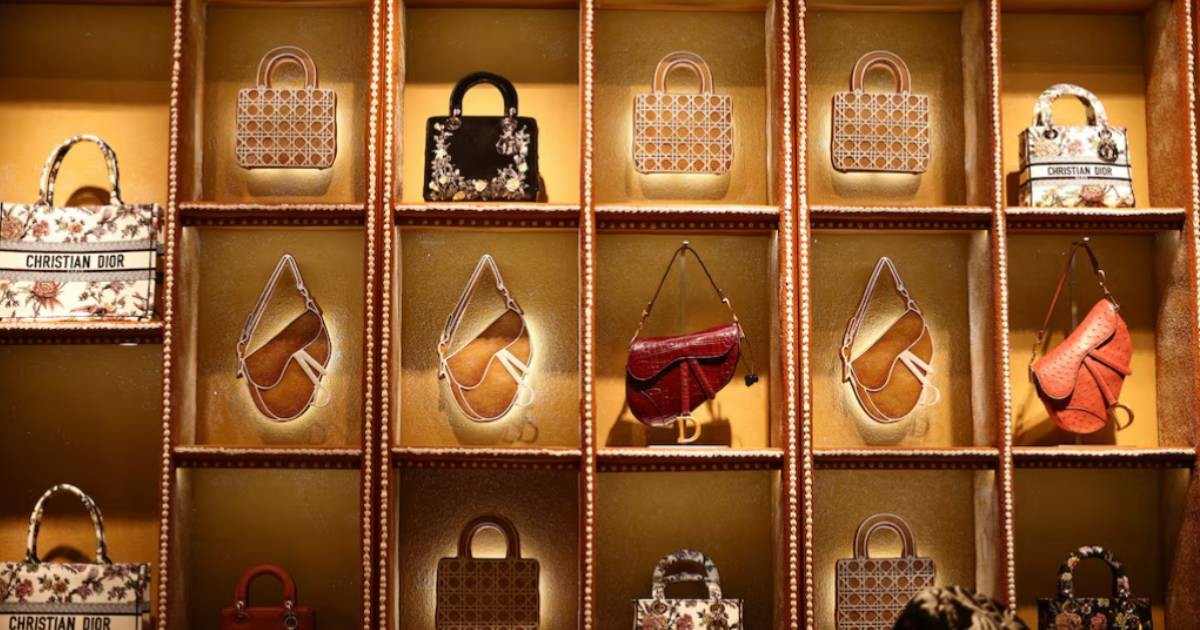 Luxury labels bulk up on lower-priced goods to appeal to middle-class shoppers