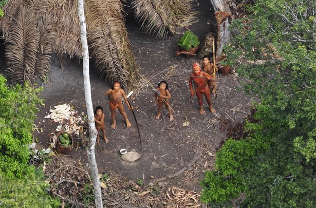 Incredible images of forgotten Amazon rainforest tribe who discourage outsiders with foot spikes