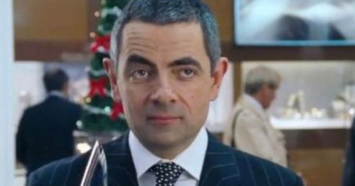 Love Actually fans only just realising real reason Rowan Atkinson's character took so long to wrap present