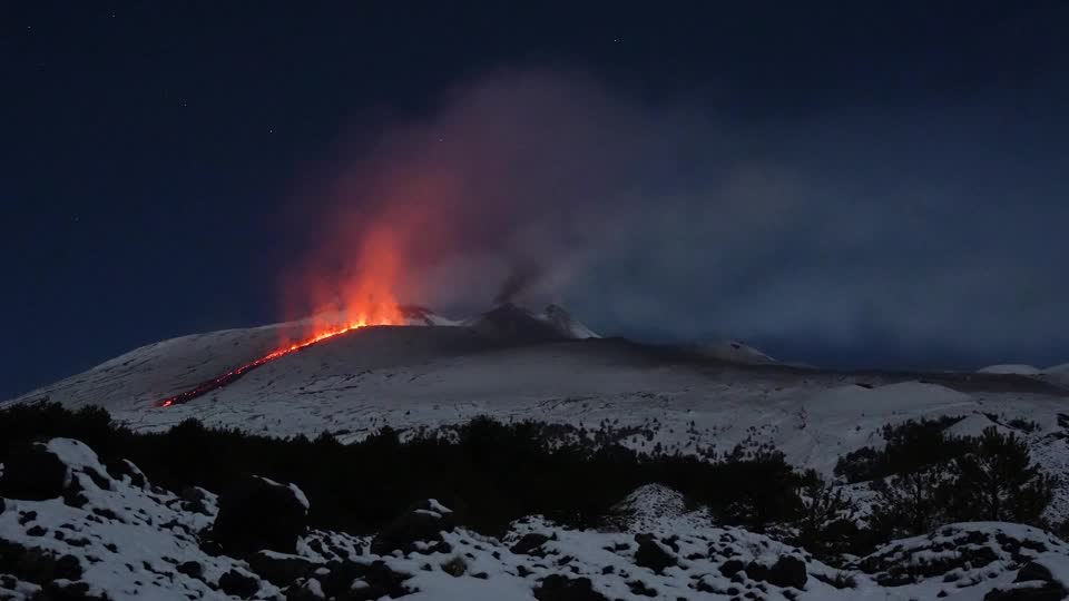Lava meets snow in spectacular night eruption of mount etna