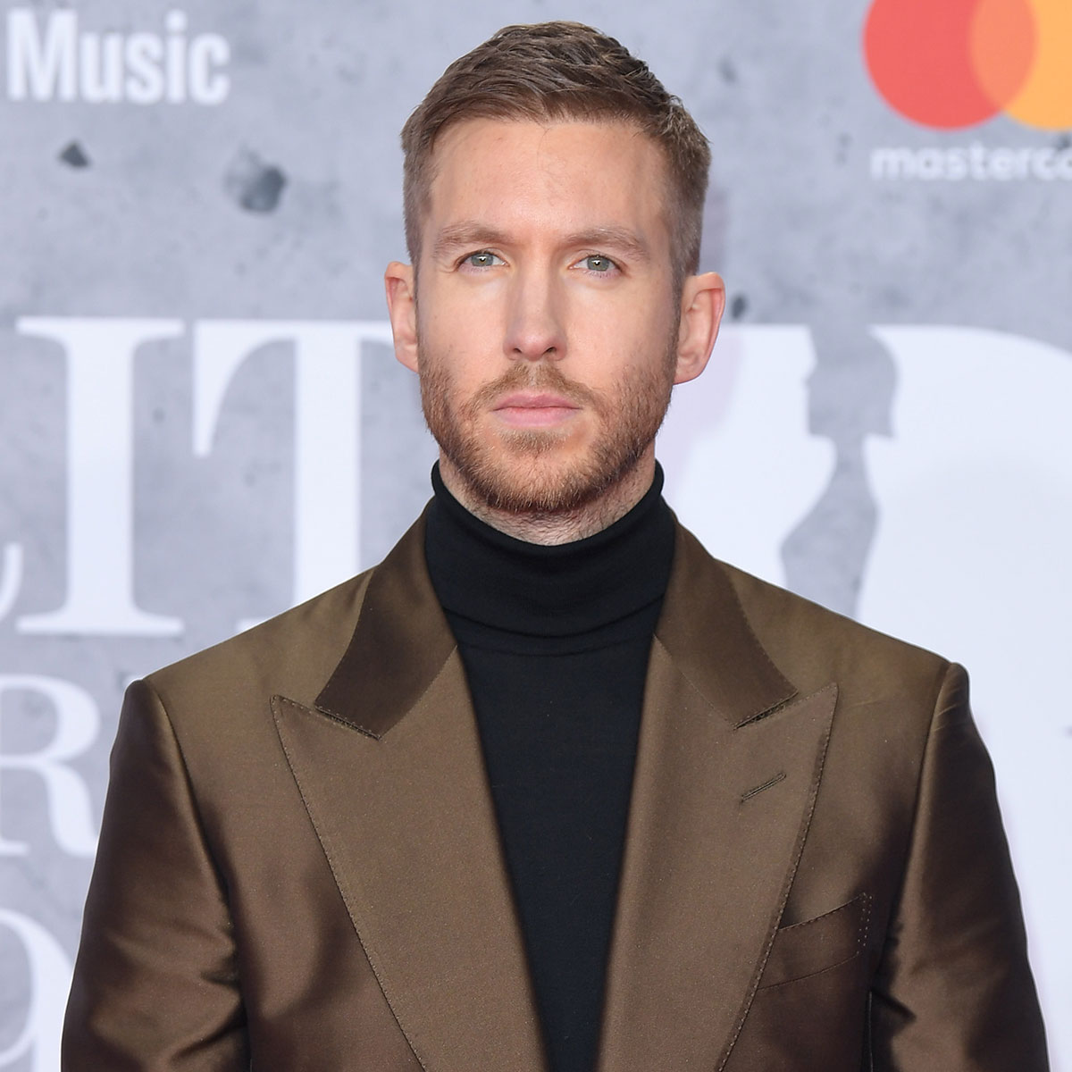 Calvin Harris Looks Unrecognizable With Long Hair and Beard Transformation