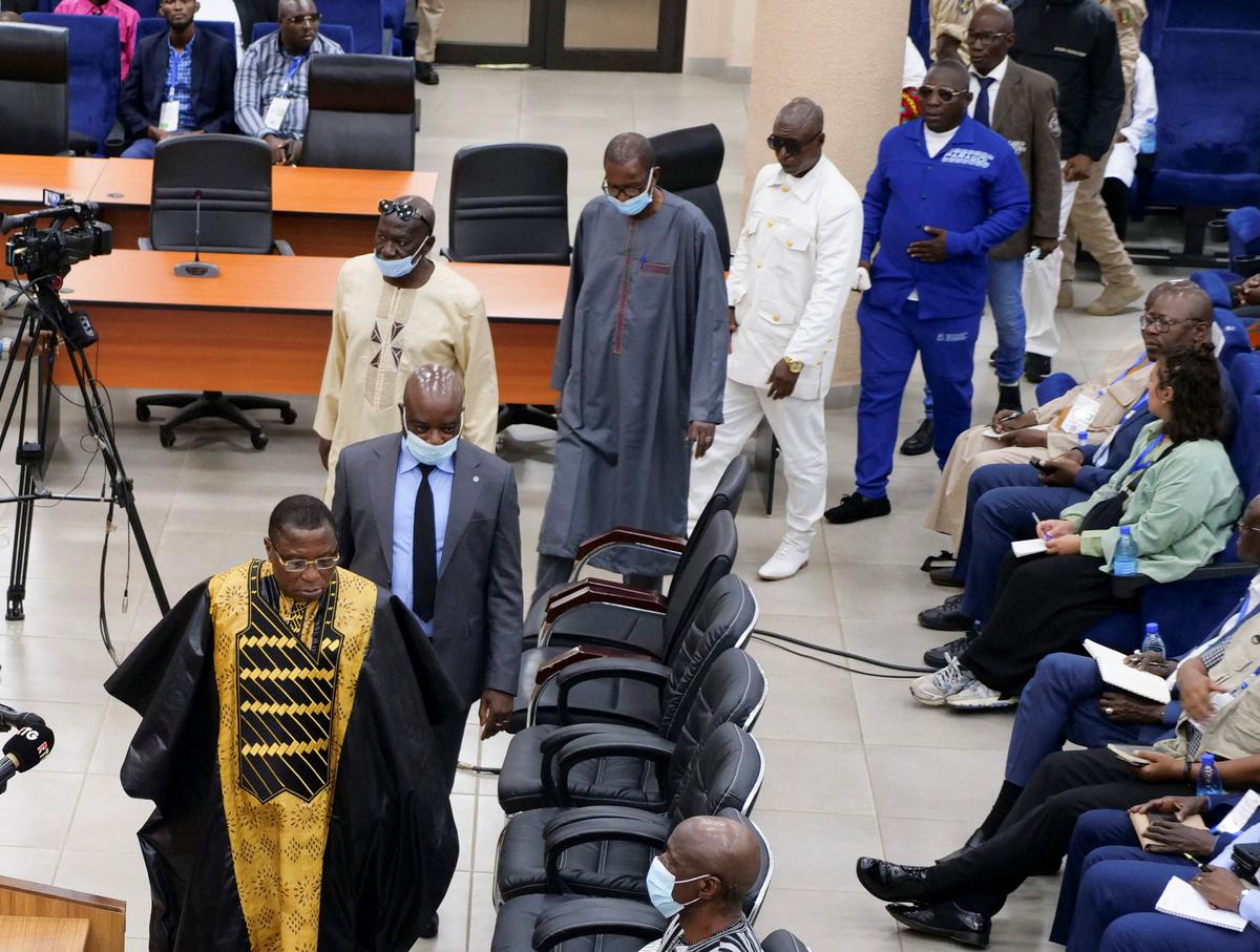 Guinea junta chief pardons former military leader over stadium massacre