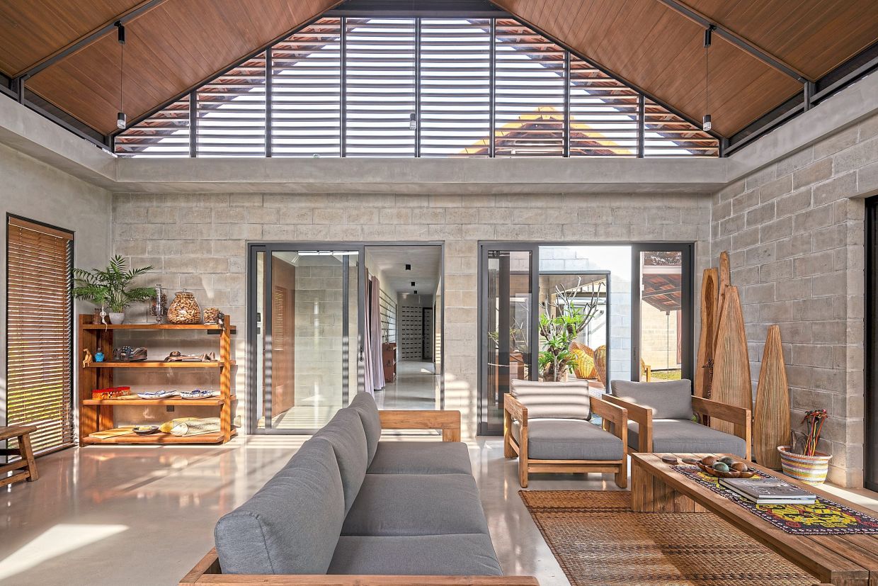 Each room in this Malaysian 1.5-storey house opens up to the outdoors