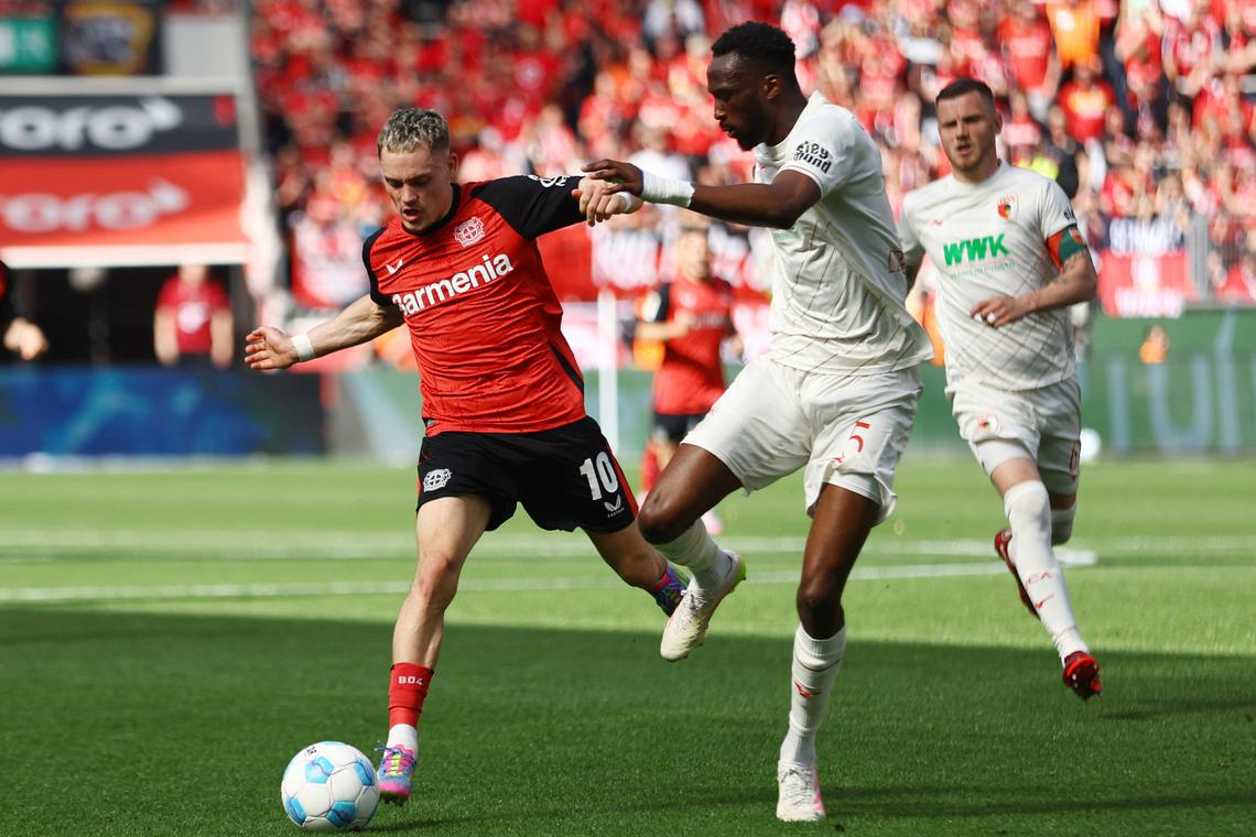 Leverkusen beat Augsburg to postpone Bayern's title celebrations
