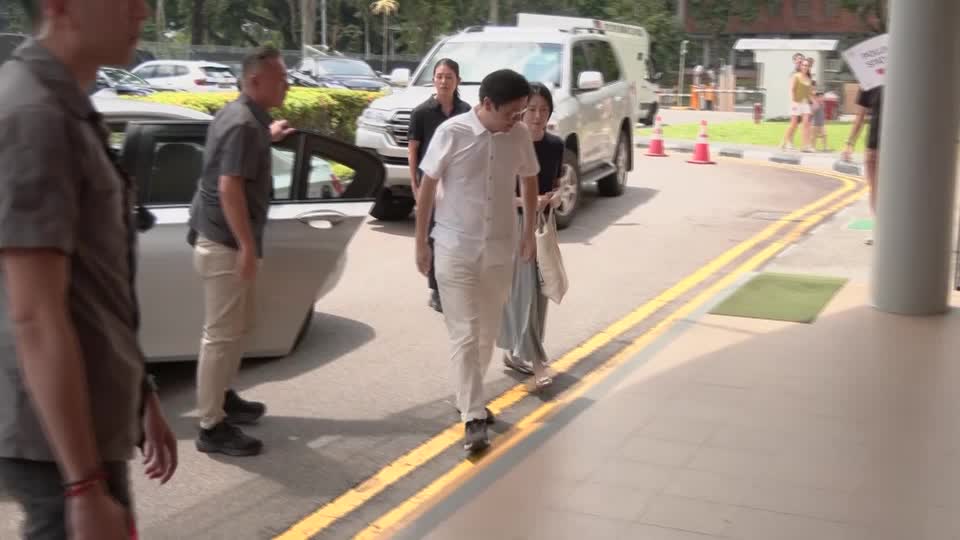 Singapore's prime minister casts his vote in first electoral test