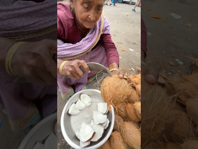 Indian Mama Sells Small Coconut At Market