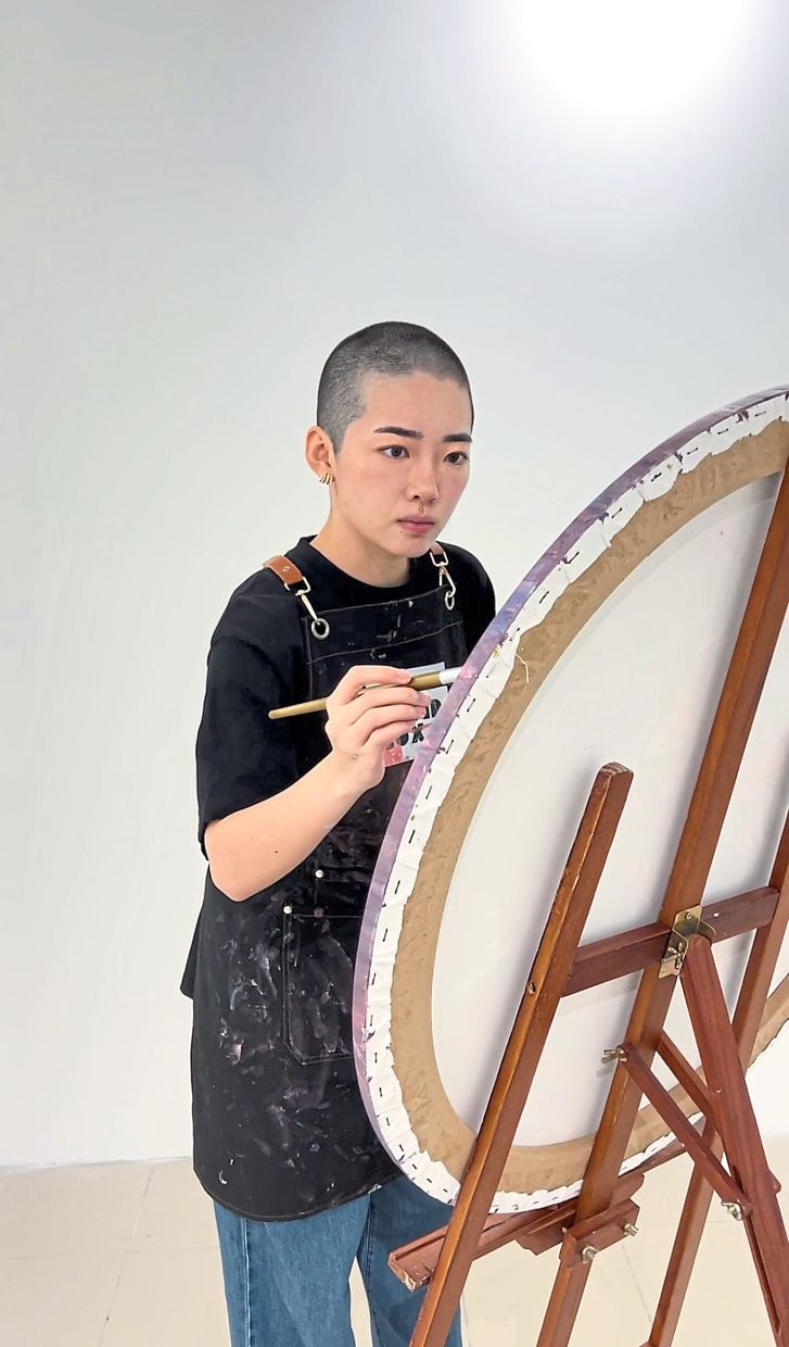 Malaysian artist shaves hair off for charity on her birthday