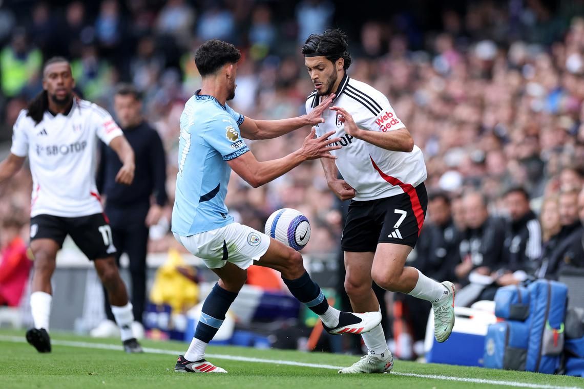 Manchester City book Champions League place with 2-0 win at Fulham