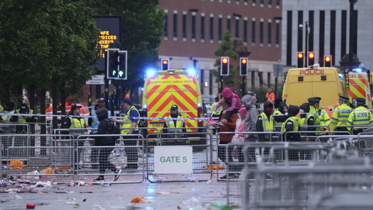Man detained after car hit crowds at Liverpool's title parade