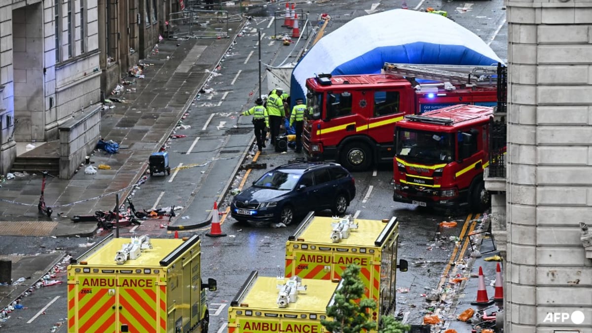 Car ploughs into fans at Liverpool parade, injuring dozens; police say incident not seen as terrorism