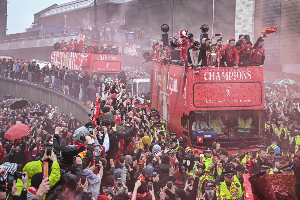 Football world rallies around Liverpool after parade horror that cops rule not terror act, 53-year-old driver arrested