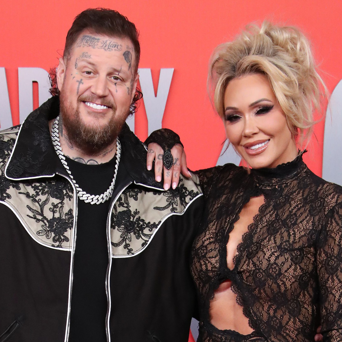Jelly Roll's Wife Bunnie Xo Claps Back at "Fake Love" Claim After Controversial Kiss