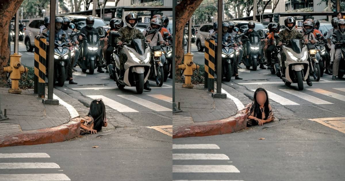 Woman crawls out of storm drain in shocking Manila street scene