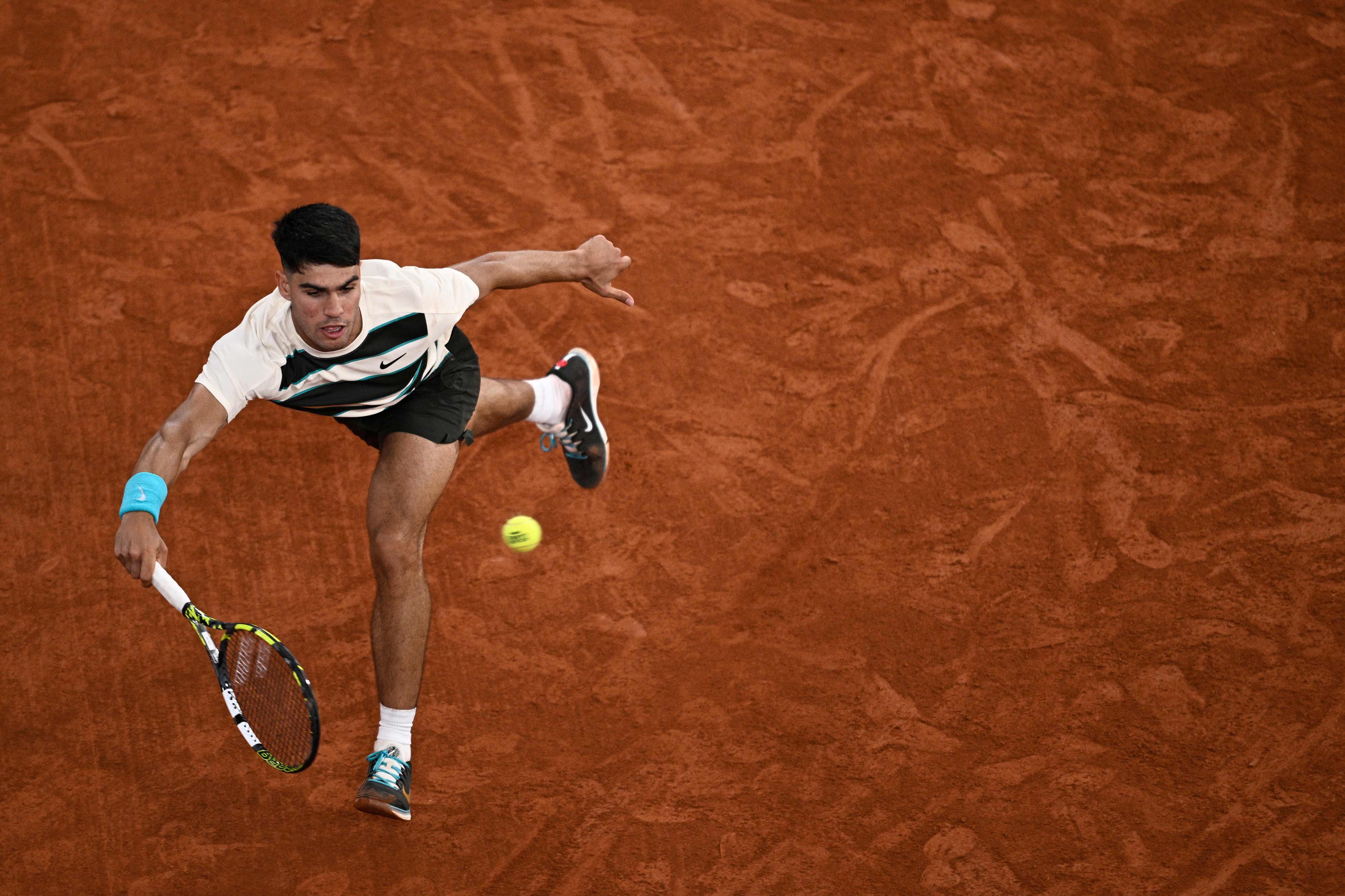 Carlos Alcaraz survives Fabian Marozsan scare to keep French Open defence on track