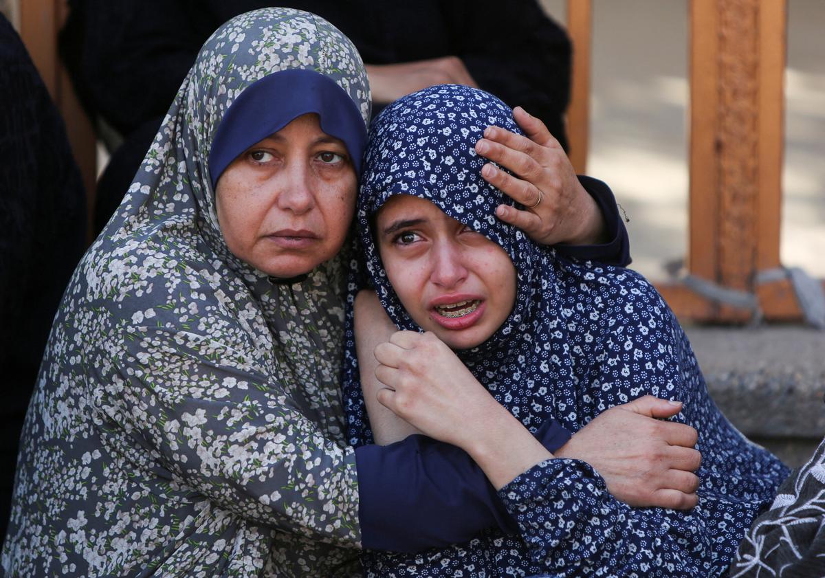 At least 27 Palestinians killed near Gaza aid site, medics say